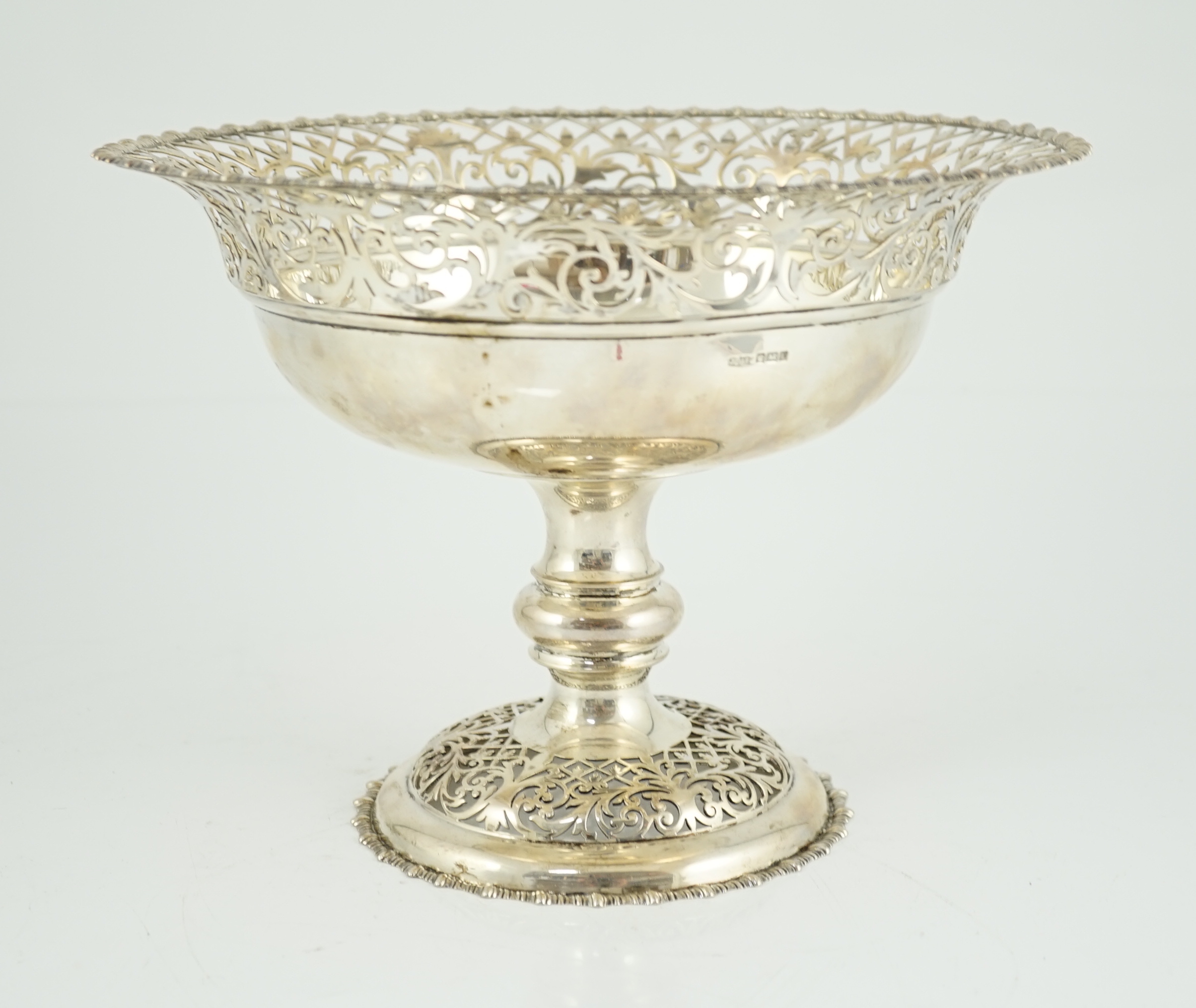 An Edwardian silver pedestal fruit bowl, with pierced border and pierced circular foot, by James Dixon & Sons